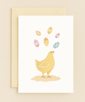 chick juggling colorful eggs card