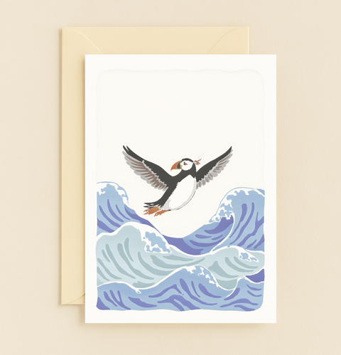 puffin soaring over ocean card